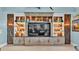 Built-in entertainment center with ample storage and lighting at 635 Key Royale Dr, Holmes Beach, FL 34217