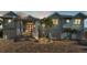 Two-story waterfront home with light blue siding and a brick driveway at 635 Key Royale Dr, Holmes Beach, FL 34217