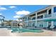 Two-story waterfront home with a large pool and patio at 635 Key Royale Dr, Holmes Beach, FL 34217