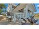 Staircase leading to a covered patio area beside the pool at 635 Key Royale Dr, Holmes Beach, FL 34217
