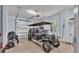 Garage with golf cart and additional storage at 635 Key Royale Dr, Holmes Beach, FL 34217
