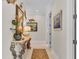 Elegant hallway with ornate console table and coastal artwork at 635 Key Royale Dr, Holmes Beach, FL 34217
