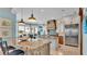 Kitchen with granite island, stainless steel appliances, and view at 635 Key Royale Dr, Holmes Beach, FL 34217