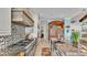 Modern kitchen with stainless steel appliances and custom cabinetry at 635 Key Royale Dr, Holmes Beach, FL 34217