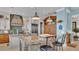 Island kitchen with granite countertops and stainless steel appliances at 635 Key Royale Dr, Holmes Beach, FL 34217