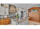 Gourmet kitchen with granite countertops, stainless steel appliances, and custom cabinetry at 635 Key Royale Dr, Holmes Beach, FL 34217