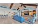 Living area with high ceilings, blue walls and comfortable seating at 635 Key Royale Dr, Holmes Beach, FL 34217