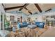 Spacious living room with vaulted ceilings, comfy sofas, and a stunning view at 635 Key Royale Dr, Holmes Beach, FL 34217