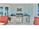 Outdoor kitchen with grill, sink, and ample counter space at 635 Key Royale Dr, Holmes Beach, FL 34217