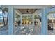 Covered patio area with a view of the water and palm trees at 635 Key Royale Dr, Holmes Beach, FL 34217