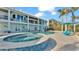 Inviting pool and spa with a mosaic tile design at 635 Key Royale Dr, Holmes Beach, FL 34217