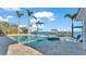 Freeform pool and spa with a large patio, overlooking the water at 635 Key Royale Dr, Holmes Beach, FL 34217