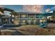 Spacious backyard oasis with a large pool, spa, and patio area at 635 Key Royale Dr, Holmes Beach, FL 34217