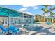 Relaxing pool and spa area with lounge chairs and umbrellas at 635 Key Royale Dr, Holmes Beach, FL 34217