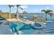 Luxury pool and spa overlooking the water with private dock at 635 Key Royale Dr, Holmes Beach, FL 34217