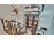 Elegant staircase with modern metal railing at 635 Key Royale Dr, Holmes Beach, FL 34217