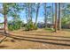 Spacious backyard with playset and mature trees at 6412 Jarvis Rd, Sarasota, FL 34241