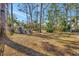 Spacious backyard with a playset and plenty of room for outdoor activities at 6412 Jarvis Rd, Sarasota, FL 34241