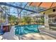 Inviting screened-in pool area, perfect for relaxation and entertainment at 6412 Jarvis Rd, Sarasota, FL 34241