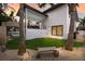 Artificial turf lawn with modern landscaping at 6605 Gulf Dr, Holmes Beach, FL 34217
