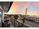 Private balcony overlooking the street and ocean sunset at 6605 Gulf Dr, Holmes Beach, FL 34217