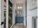 Small bathroom with blue vanity and balcony view at 6605 Gulf Dr, Holmes Beach, FL 34217