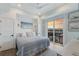 Main bedroom with king bed and balcony access at 6605 Gulf Dr, Holmes Beach, FL 34217