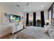 Bedroom with king-size bed, TV, and balcony access at 6605 Gulf Dr, Holmes Beach, FL 34217