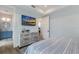 Guest bedroom with dresser and en-suite bathroom at 6605 Gulf Dr, Holmes Beach, FL 34217