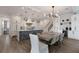 Bright dining area with concrete table and woven chairs, adjacent to kitchen at 6605 Gulf Dr, Holmes Beach, FL 34217