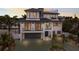 Luxury beachfront home with modern design, three-car garage, and spacious driveway at 6605 Gulf Dr, Holmes Beach, FL 34217