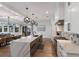 Open concept kitchen with marble countertops, modern appliances, and a large island at 6605 Gulf Dr, Holmes Beach, FL 34217