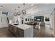Open concept kitchen with large island, modern appliances, and white cabinetry at 6605 Gulf Dr, Holmes Beach, FL 34217