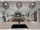 Open living space with a large sectional sofa, dining table, and ocean views at 6605 Gulf Dr, Holmes Beach, FL 34217