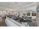 Spacious living room with comfortable seating, built-in shelving, and large windows at 6605 Gulf Dr, Holmes Beach, FL 34217
