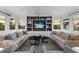 Spacious living room with comfortable seating, built-in shelving, and large windows at 6605 Gulf Dr, Holmes Beach, FL 34217