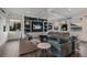 Spacious living room with comfortable seating, built-in shelving, and large windows at 6605 Gulf Dr, Holmes Beach, FL 34217