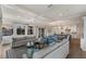 Spacious living room with comfortable seating, built-in shelving, and large windows at 6605 Gulf Dr, Holmes Beach, FL 34217