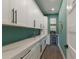 Walk-in pantry with white cabinets and quartz countertops at 6605 Gulf Dr, Holmes Beach, FL 34217