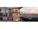 Modern condo building showcasing luxurious amenities and sunset views at 668 Quay Commons # 0705, Sarasota, FL 34236