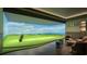 High-tech golf simulator with lounge area and ocean views at 668 Quay Commons # 0705, Sarasota, FL 34236