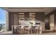 Modern kitchen with island, custom cabinetry, and high-end appliances at 668 Quay Commons # 0705, Sarasota, FL 34236