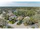Aerial view of single Gathering home with lush landscaping at 6710 Pebble Beach Way, Lakewood Ranch, FL 34202