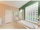 Bathroom with shower, bathtub, and double sinks at 6710 Pebble Beach Way, Lakewood Ranch, FL 34202
