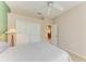 Bedroom with ceiling fan and access to the dining room at 6710 Pebble Beach Way, Lakewood Ranch, FL 34202
