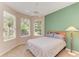 Bright bedroom with a ceiling fan and large windows at 6710 Pebble Beach Way, Lakewood Ranch, FL 34202