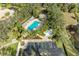 Aerial view showing community pool, parking, and lush landscaping at 6710 Pebble Beach Way, Lakewood Ranch, FL 34202