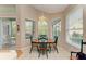 Kitchen breakfast nook with wood table and chairs, offering natural light at 6710 Pebble Beach Way, Lakewood Ranch, FL 34202