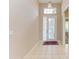 Bright entryway with tile flooring and a small area rug at 6710 Pebble Beach Way, Lakewood Ranch, FL 34202