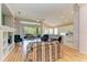Open living room with built-in shelving and hardwood floors at 6710 Pebble Beach Way, Lakewood Ranch, FL 34202